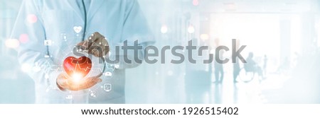 Cardiologist doctor with stethoscope touching heart shape and medical icon network connection on modern virtual screen networking interface on hospital background, Health care, Medical and patient.