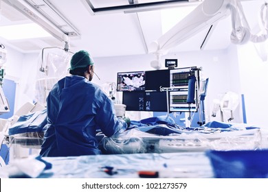 Cardiologist doing catheter ablation with radiofrequency energy using imaging system with fluoroscopic X-ray tube for interventional vascular procedures and electrophysiology. image guided system