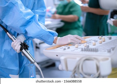 Cardiologist holding transesophageal ultrasound probe and use echocardiogram to assessment patient’s heart in cardiac operating room