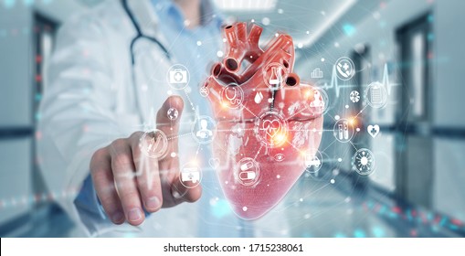 Cardiologist On Blurred Background Using Digital X-ray Of Human Heart Holographic Scan Projection 3D Rendering