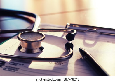 cardiologist stethoscope paper insurance