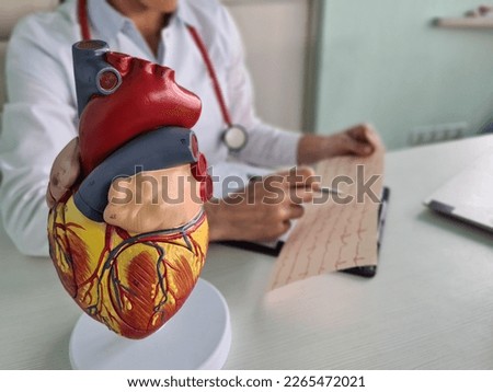 Cardiologist studies electrocardiogram analysis symptoms and makes diagnosis. Heart and vascular disease causes symptoms
