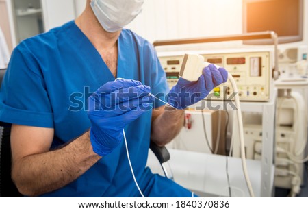 Cardiologist use tubes and ultrasound for radiofrequency catheter ablation. Stock foto © 