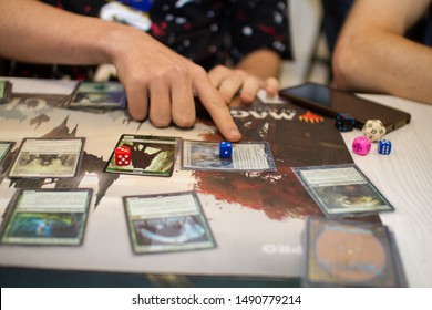 Cards of board game Magic The Gathering are on the table. New expansion game. friends play cards at home. Blagoveshensk, Russia - july 14, 2019