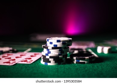 Cards And Chips On Green Felt Casino Table. Abstract Background With Copy Space. Gambling, Poker, Casino And Cards Games Theme. Casino Elements On Green. Selective Focus