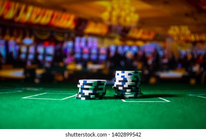 Cards And Chips On Green Felt Casino Table. Abstract Background With Copy Space. Gambling, Poker, Casino And Cards Games Theme. Casino Elements On Green. Selective Focus