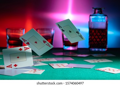 Cards fall on a casino table . Concept of gambling. Copy space.