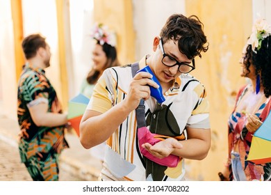 Care During Carnival. Man Using Sunscreen During Carnival Block