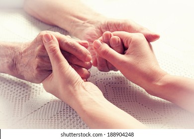 Care Is At Home Of Elderly. Space For Text. Senior Man, Woman With Their Caregiver At Home. Concept Of Health Care For Elderly Old People, Disabled. Elderly Man. 