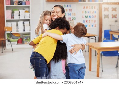 Care, teacher with school children hug and in a classroom with a lens flare. Support or love, happiness or teaching and happy or cheerful woman with kindergarten kids hugging together in a class - Powered by Shutterstock