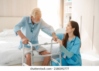 Care worker or nurse helping elderly man get out of bed and walk around the room. - Powered by Shutterstock