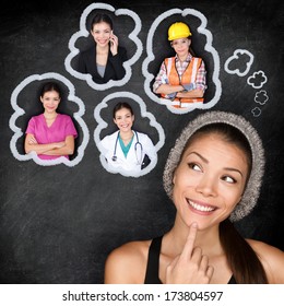 Career Choice Options - Student Thinking Of Future Education. Young Asian Woman Contemplating Career Options Smiling Looking Up At Thought Bubbles On A Blackboard With Images Of Different Professions