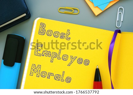 Career concept about Boost Employee Morale with phrase on the sheet.