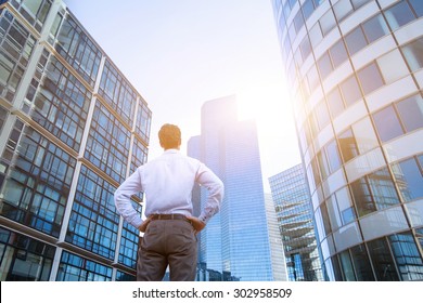 career concept, business background, man looking at office buildings - Shutterstock ID 302958509