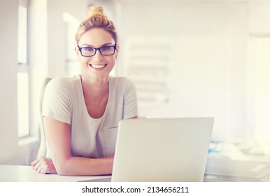 Career Confidence. Portrait Of A Happy Woman Working At Her Desk In A Casual Office Environment.