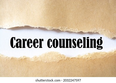 Career Counseling Word ,appearing Behind Torn Brown Paper. Business