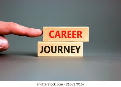 Career journey symbol. Concept words Career journey on wooden blocks on a beautiful grey table grey background. Businessman hand. Business Career journey concept. Copy space.