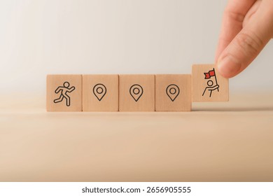 Career Path and Development Strategy Concept. Arranging wooden blocks with icons success roadmap and journey, symbolizing a structured career path and strategic development. Planning, growth, progress