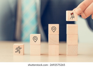 Career Path and Development Strategy Concept. Arranging wooden blocks with icons success roadmap and journey, symbolizing a structured career path and strategic development. Planning, growth, progress