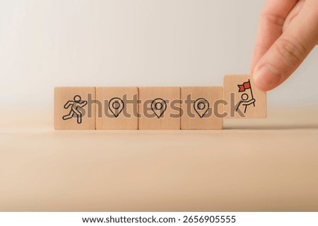 Career Path and Development Strategy Concept. Arranging wooden blocks with icons success roadmap and journey, symbolizing a structured career path and strategic development. Planning, growth, progress