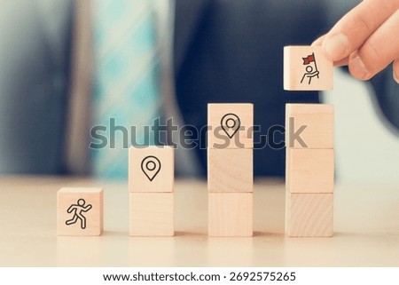 Career Path and Development Strategy Concept. Arranging wooden blocks with icons success roadmap and journey, symbolizing a structured career path and strategic development. Planning, growth, progress