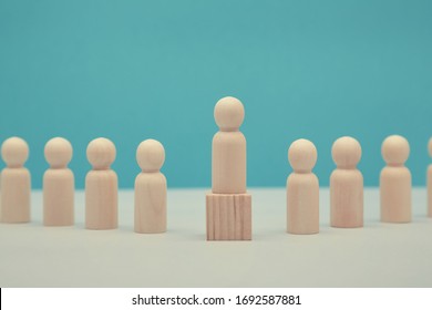 Career Success Mockup. Sense Of Purpose And Efficiency. Leadership And Superiority. Wooden Leader Figure Stands On Cube