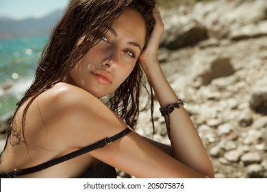 Carefree Beautiful Brunette With Wet Look & Long Hair On The Beach. Natural Woman Beauty. Toned In Warm Colors. Copy Space For Your Text. Horizontal Shot, Outdoors