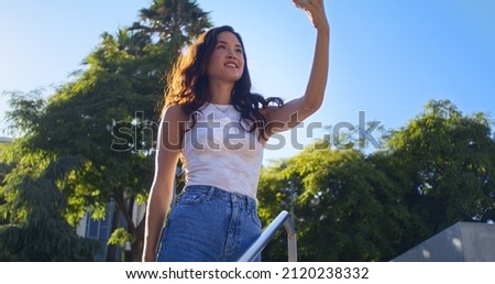 Similar – Brünette Frau, die mit einem Handy einen Fluss fotografiert.