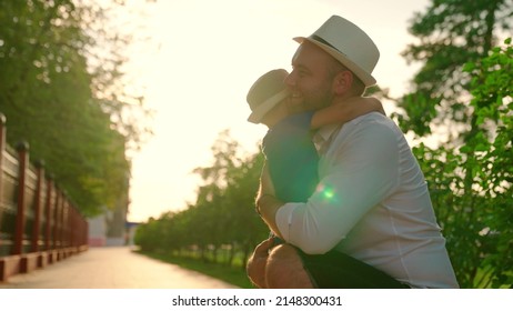 Carefree Childhood, Joyful Run Of Baby To His Father. Happy Family Embrace. Child, Son Runs To His Father And Hugs. Family In Park In Summer. Small Child Has Fun Playing Outdoors In Summer With Parent