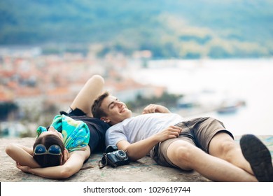 Carefree Couple Relaxing,looking At The Cityscape View.Making A Company.Stress Free,freedom Feeling.Happiness And Mindfulness.Serene Relationship.Soul Mates.Best Friends Hanging Out.Deep Conversation