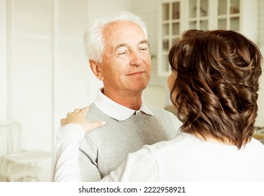 Carefree Happy Active Old Senior Couple Dancing In Kitchen