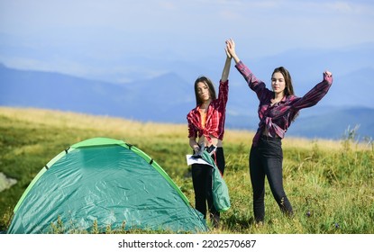 Carefree And Happy. Friends Spend Free Time Together. Family Camping. Reach Destination Place. Hiking Outdoor Adventure. Two Girls Pitch Tent. Wanderlust Discovery. Mountain Tourism Camp