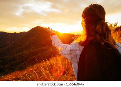 Carefree hipster girl enjoying sunset on top of mountain. Image of freedom concept. Model meditates while travel holidays vacation outdoors. Photo toned style instagram filters, vintage effect.  - Shutterstock ID 1566460447