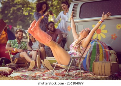 Carefree hipster having fun on campsite at a music festival - Powered by Shutterstock