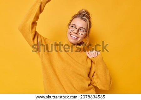 Similar – girl on a yellow air mattress in a grey backyard