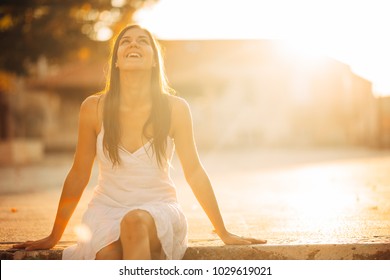 Carefree Woman Enjoying In Nature,beautiful Red Sunset Sunshine.Finding Inner Peace.Spiritual Healing Lifestyle.Enjoying Peace,anti-stress Therapy,mindfulness Meditation.Positive Energy.Freedom