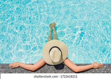 Carefree woman relaxation in swimming pool summer Holiday concept