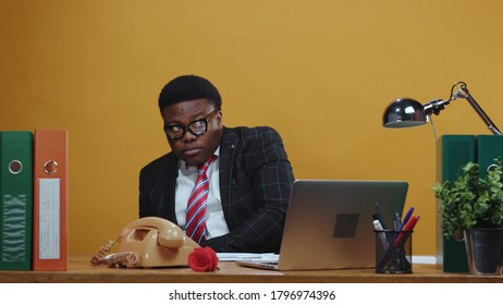 Careful Scared Black Head Businessman Counting His Money On Payday Hides Under Table Of Much Jealousy. Greedy Boss. Office Company. Comical Scene. Fun. Copy Space.