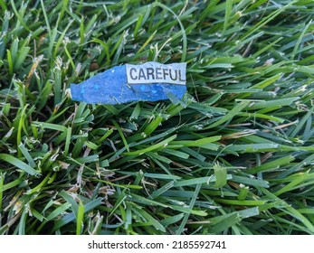 careful warning on grass; an ill omen for walkers - Shutterstock ID 2185592741