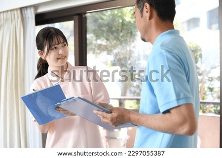 Caregiver Asian men and women in a meeting