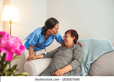 Caregiver, Carer Hand Holding Elder Hand Woman In Hospice Care. Philanthropy Kindness To Disabled Concept.Public Service Recognition Week. Attentive Young Doctor Talks With Female Patient