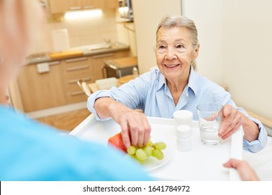 Caregiver Delivers Healthy Breakfast To Senior Woman In Her Senior Citizen Home