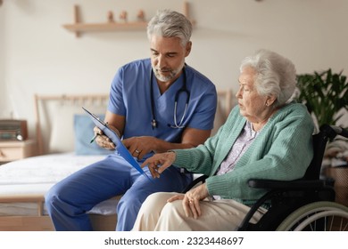 Caregiver doing regular check-up of senior woman in her home. - Powered by Shutterstock