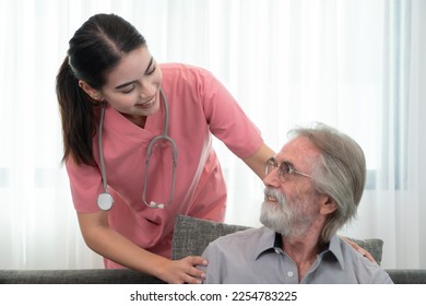 Caregiver for an elderly man Weekly check-ups at the patient's residence. Ready to give medical advice and talk about various stories, exchange each other happily. - Shutterstock ID 2254783225
