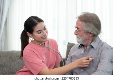 Caregiver for an elderly man Weekly check-ups at the patient's residence. Ready to give medical advice and talk about various stories, exchange each other happily. - Shutterstock ID 2254783233