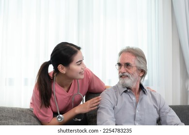 Caregiver for an elderly man Weekly check-ups at the patient's residence. Ready to give medical advice and talk about various stories, exchange each other happily. - Shutterstock ID 2254783235