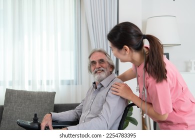 Caregiver for an elderly man Weekly check-ups at the patient's residence. Ready to give medical advice and talk about various stories, exchange each other happily. - Shutterstock ID 2254783395