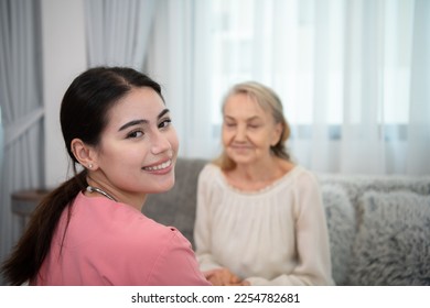 Caregiver for an elderly woman Weekly check-ups at the patient's residence. Ready to give medical advice and talk about various stories, exchange each other happily. - Shutterstock ID 2254782681