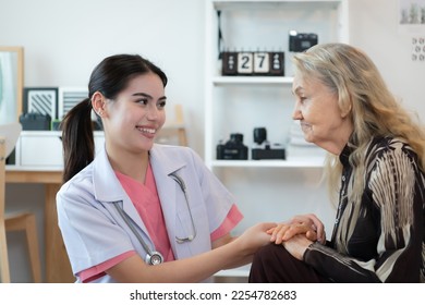 Caregiver for an elderly woman Weekly check-ups at the patient's residence. Ready to give medical advice and talk about various stories, exchange each other happily. - Shutterstock ID 2254782683
