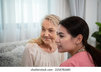 Caregiver for an elderly woman Weekly check-ups at the patient's residence. Ready to give medical advice and talk about various stories, exchange each other happily. - Shutterstock ID 2254782685